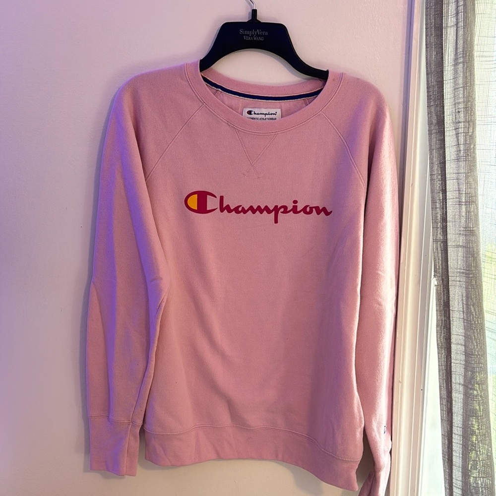Pink Champion crewneck sweatshirt.